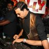 Akshay Kumar turns DJ to promote his film "Action Replayy" at Plollyesters