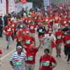 Participants during the Delhi Half Marathon, in New Delhi on Sunday