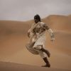 Abhishek running on the sand | Drona Photo Gallery