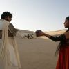 Abhishek Bachchan : Priyanka giving something to Abhishek
