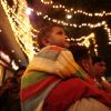 Kolkata: A child enjoys the ride of his father's soulder during the eve of up coming New Year 2011 in Kolkata on Wednesday. .