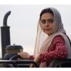 Preity Zinta  sitting on a tractor