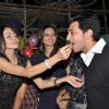 Parul Chaudhry feeds cake to Yash Pandit at party while Shama Sikander looks on