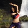 Gayatri dancing near the waterfall