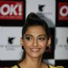 Sonam Kapoor shows off the OK magazine cover at its launch event held at Enigma in Mumbai