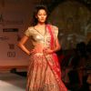 Model walks the ramp for designer Varun Bhal's creation at the Synergy one Delhi Couture Week