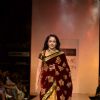Hema Malini display creations by designers Bhumika and Shyamal during Lakme Fashion Week Day 3 in Mumbai. .