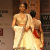 A model displays a creation by designer Manish Malhotra at the Wills Lifestyle India Fashion week 2012,in New Delhi on Friday. .