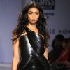 A model displays a creation by designer Rimzim Dadu at the Wills Lifestyle India Fashion week 2012,in New Delhi on Friday. .