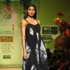 A model displays a creation by designer Ravi Bajaj  during a special show at the Wills Lifestyle India Fashion week 2012,in New Delhi on Friday. .