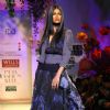 A model displays a creation by designer Tarun Tahiliani  during a special show at the Wills Lifestyle India Fashion week 2012,in New Delhi on Friday. .