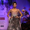 A model displays a creation by designer Ritu Beri  during a special show at the Wills Lifestyle India Fashion week 2012,in New Delhi on Friday. .