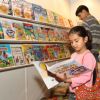 Children at a book stall during the 20 th World Book Fair, in New Delhi on Saturday. .