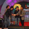 Ranbir Kapoor, Imtiaz Ali and Mohit Chauhan present AR Rahman with an award at the FICCI Frames Excellence Awards 2012. .