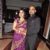 Singer Sunidhi Chauhan poses with her husband musician Hitesh Sonik at her wedding reception