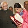 Vice President Hamid Ansari presenting the best actress award to Vidya Balan at the ''59 National Film Awards''