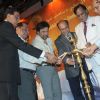 Chandru Punjabi, Govinda and Ram Jawhrani lighting up lamp at Mother Teresa Award