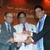 Lachhman Chatnani and Ram Jawhrani awarding Chandru Punjabi at Mother Teresa Award