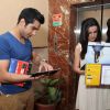 Mohit Sehgal & Sanaya Irani browsing the calendar at the celebration of India Forums 9th Anniversary