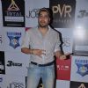 Mika Singh strikes a pose at the Premiere of JOBS