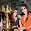 Soha Ali Khan lights the inaugural lamp at the Glamour Jewellery Exhibition with Bulbeer Gandhi