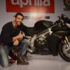 John Abraham poses with his new super bike Aprilia RSV4