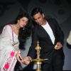 Nimrat Kaur and Akshay Kumar light the inaugral lamp at the Jagran Film Festival 2013