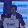 Ranbir Kapoor holds up the 'Besharam' T-shirt at the event