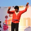 Abhishek Bachchan uses a hoolahoop at the Women's Half Marathon