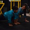 Sadhil and Malaika Arora Khan do some push ups on Captain Tiao