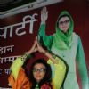 Rakhi Sawant with her political party banner of 'Rashtriya Aam Party'
