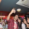Varun Dhawan clicks a selfie with his fans