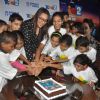 Sonakshi Sinha cuts a cake with the children at a special screeing of Rio 2