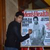 Sidharth Malhotra signs the Men's Health cover