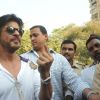 Shahrukh Khan poses with an inked finger