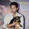 Armaan Jain poses with a puppy