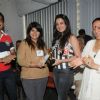 Bharat and Dorris Godambe with Amy Billimoria felicitating a Student