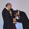 Shahrukh Khan bends in humility at the event