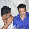 Suniel Shetty shares a joke with Salman Khan at Baba Siddiqie's Iftar Party