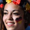 A fan paints the German flag on face