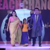 Guests with a child walk the ramp at the Teach for Change 2014 Fashion Show