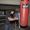 Akhil Kapur practices few punches on a punching bag at the Promotions of Desi Kattey
