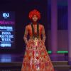A model walks the ramp at the Indian Couture Week - Day 4