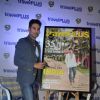 Rajeev Khandelwal poses with the Travel Magazine Poster