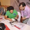 Sachin Tendulkar autographs a book at Durgapur Tribute Book Launch