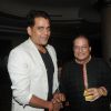 Ravi Kissen poses with Anup Jalota at his Birthday Celebration