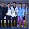 Tiger Shroff receiving his award at the Kukkiwon Award Ceremony
