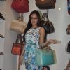 Shazahn Padamsee poses with a hand bag at the Launch of Madame's Studio Collection