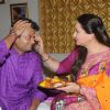 Poonam Dhillon puts a tilak on her brother's forehead for Raksha Bandhan