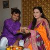Poonam Dhillon ties a rakhi on her brother's hand for Raksha Bandhan